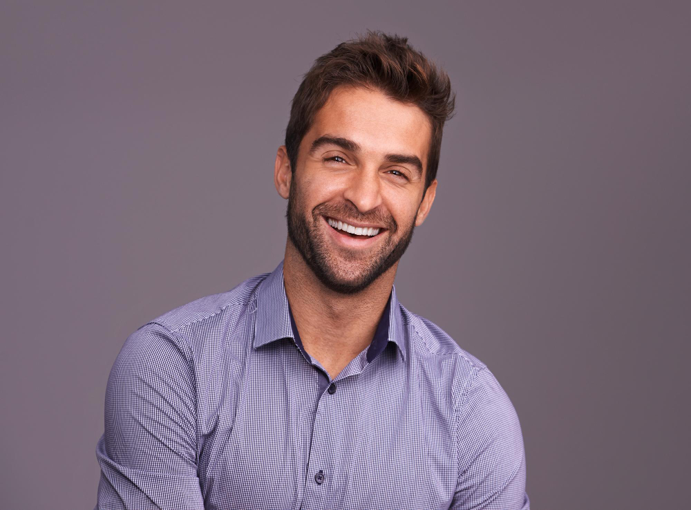 Patient smiling after restorative dental care at Country Club Dentistry