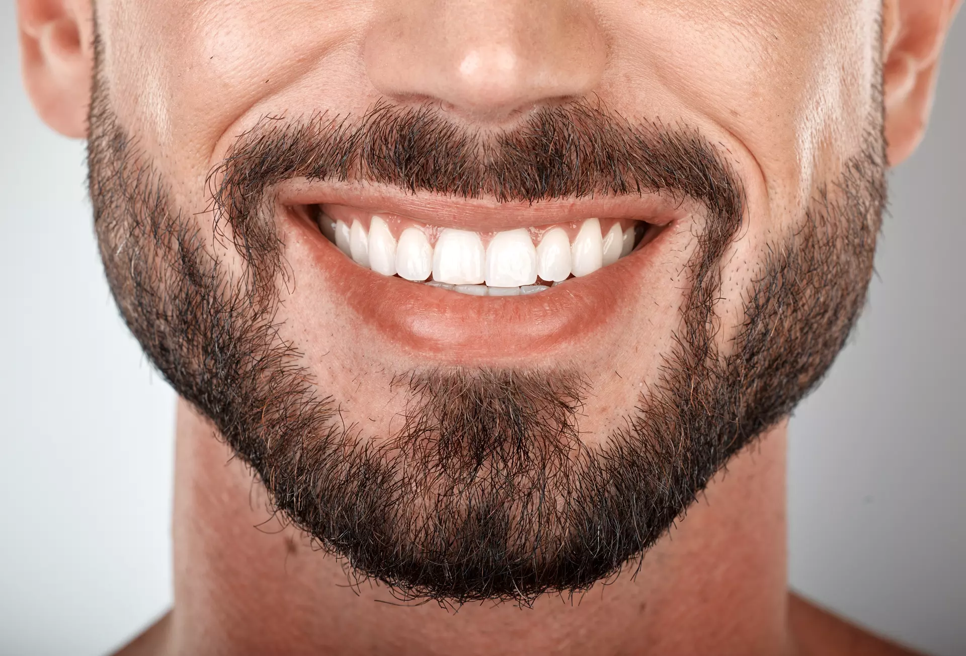 Man smiling after restorative dental treatment